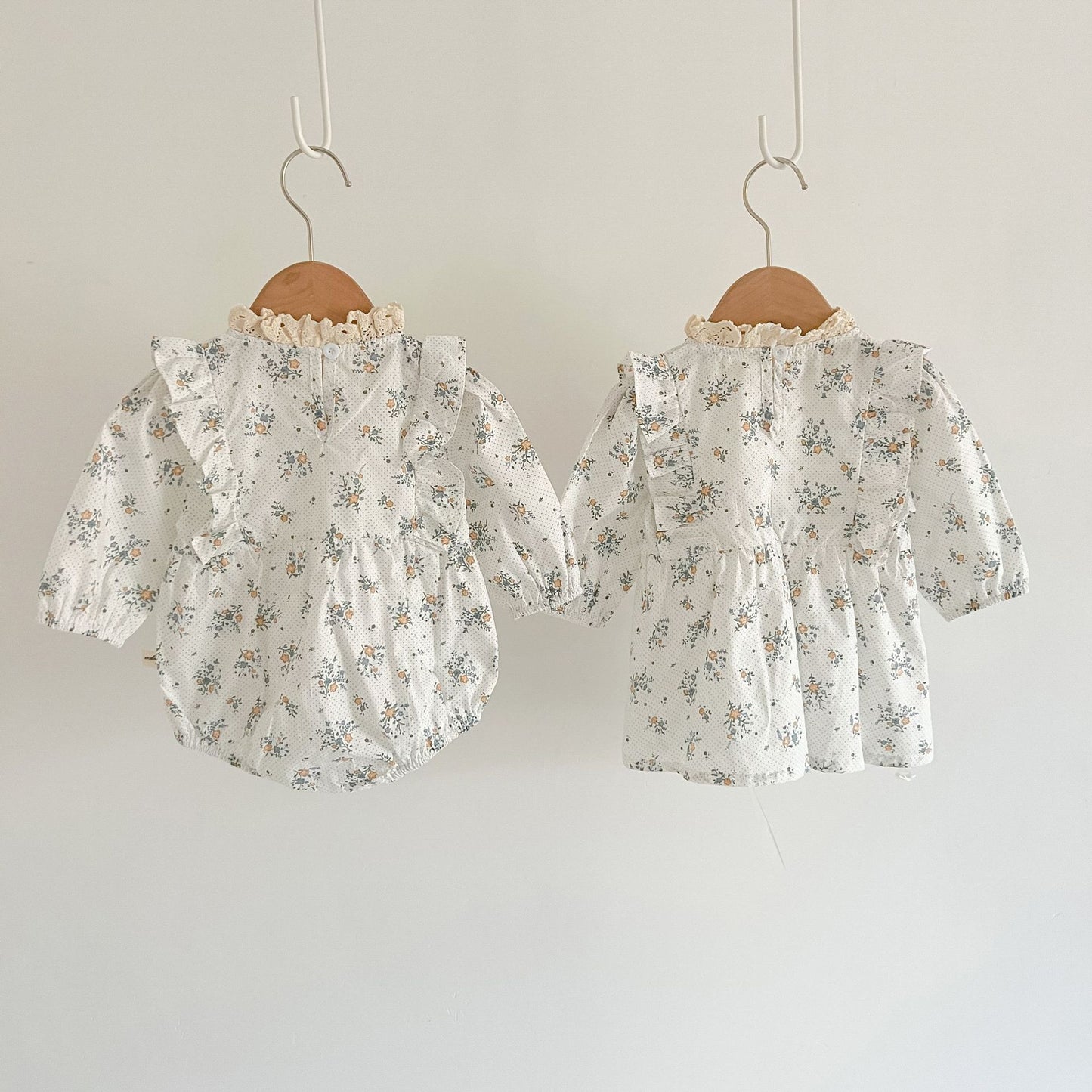 White romper or dress with flowers. Matching dress for little sisters