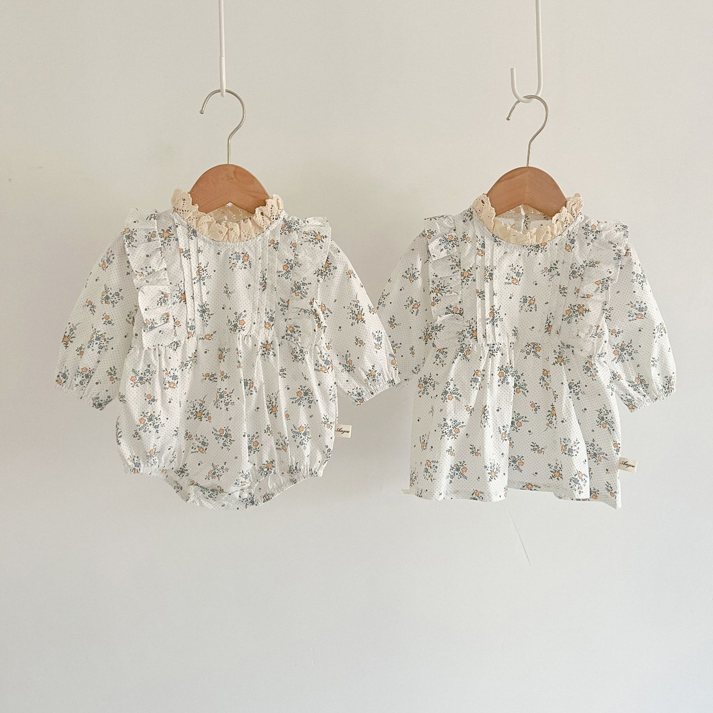 White romper or dress with flowers. Matching dress for little sisters