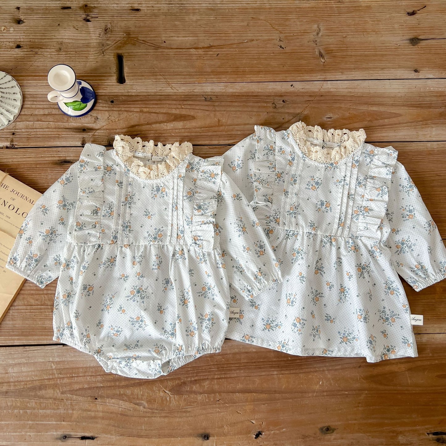 White romper or dress with flowers. Matching dress for little sisters